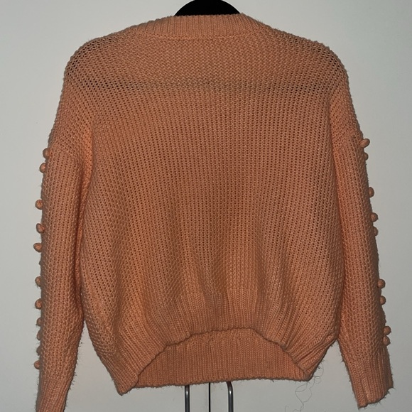 Coral knitted sweater with pom-poms - Picture 2 of 4